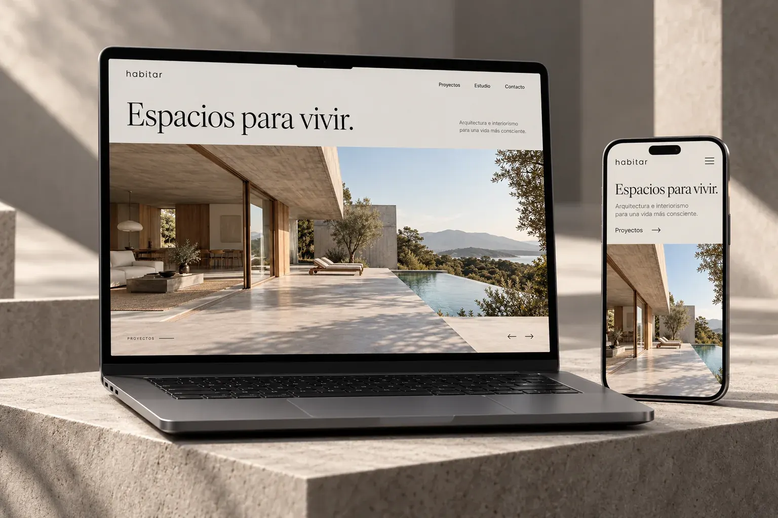 Habitar presentado en una laptop y un teléfono, con sus vistas de escritorio y móvil.